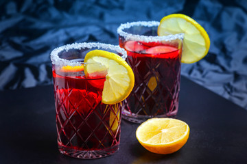 Punch drink sangria with fruit on dark background