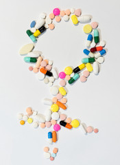 Many colorful drugs arrange in female symbol
