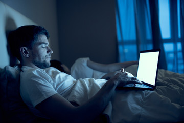 man working on laptop at home