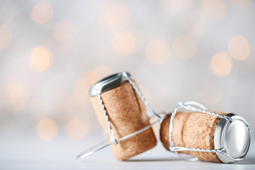 Wine corks with metal caps on blurred background