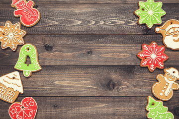 Christmas gingerbread cookies on brown wooden table