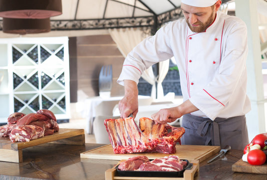 cook cooks torro steak in a restaurant