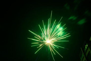 Obraz premium Fireworks over buildings