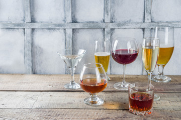 Selection of different alcoholic drinks - beer, red white wine, martini, champagne, cognac, whiskey...