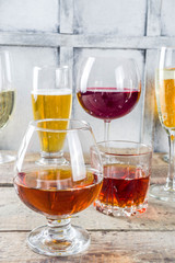 Selection of different alcoholic drinks - beer, red white wine, martini, champagne, cognac, whiskey in various glasses