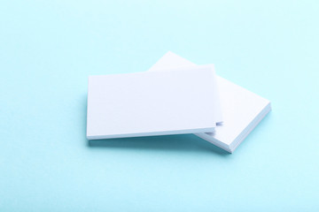 Blank business cards on blue background