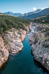Fototapeta na wymiar Fango river in Corsica and Paglia Orba mountain