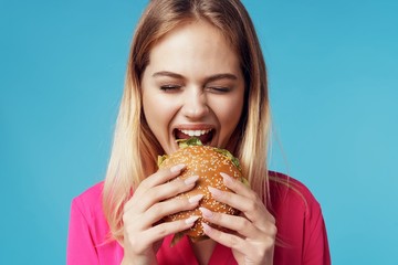 woman eating hamburger