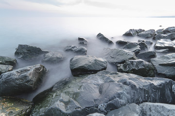 Minimalist sea and rock view with long exposure