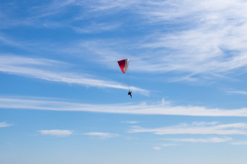 paragliding in the blue sky