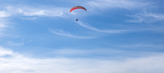 paragliding in the blue sky