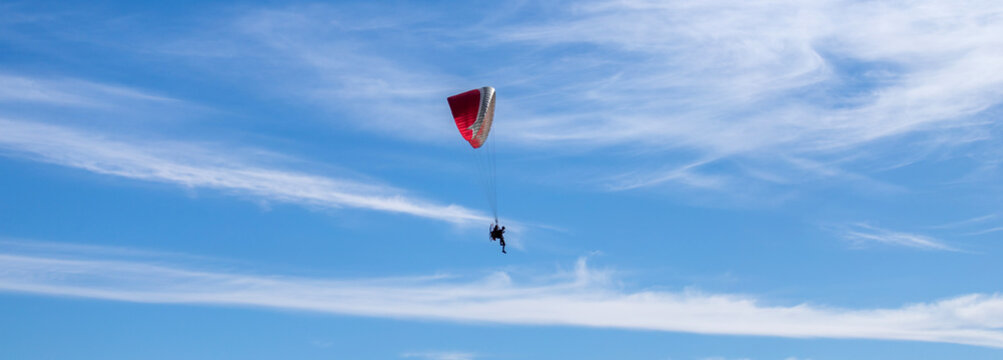 paragliding in the blue sky