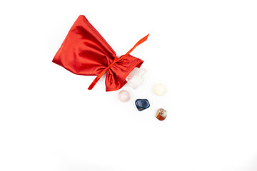 red bag with astrologer stones on a white background