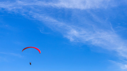 paragliding in the blue sky