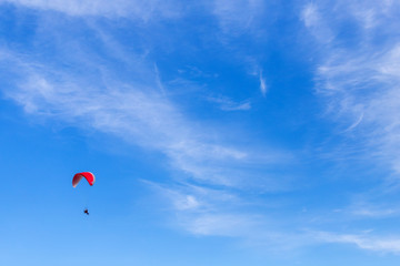 paragliding in the blue sky