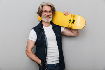 Portrait of a handsome stylish mature man wearing a vest © Drobot Dean