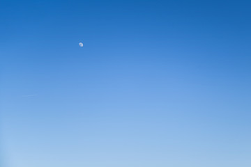 Cear blue sky without clouds with moon and airplane for background for nature background
