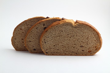 Isolate of white loaf of bread with sliced ​​pieces on a white background