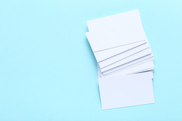 Blank business cards on blue background