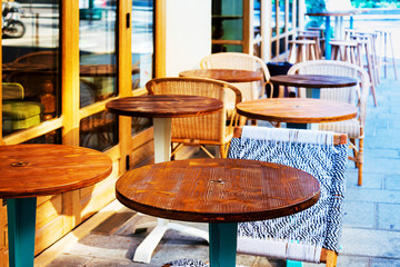 Street view of a coffee terrace with tables and chairs, Paris, France