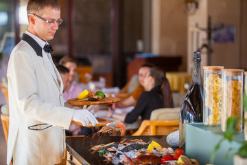 cooking seafood in a restaurant.