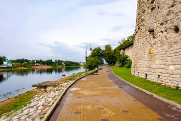 Pskov, the embankment of the Great river near the Pokrovsky fortress tower