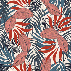 Fashionable seamless tropical pattern with bright red and blue flowers on white background. Colorful stylish floral. Beautiful print with hand drawn exotic plants.