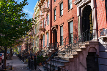 Row of Colorful Old Homes in Greenpoint Brooklyn New York along the Sidewalk