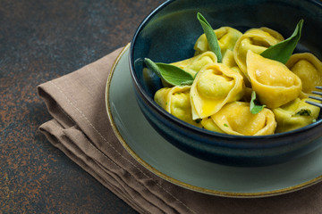 Homemade tortelloni with ricotta and spinach.