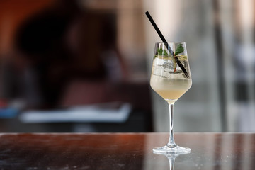 An alcoholic cocktail is on the bar. Space for text. Photo for the menu