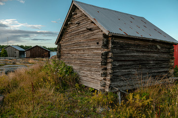 Obraz premium Scandinavian fishing village. Beautiful coastal landscape. Old, beautiful, wooden, textured buildings