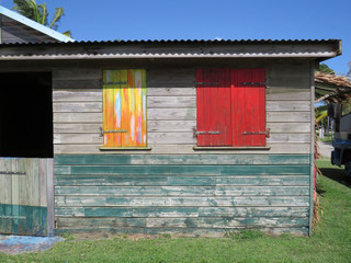 Typical colorful house in Martinique, French West Indies. Tropical multicolor windows.