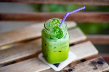 Iced green tea on the table, ready to drink Food and beverage concepts