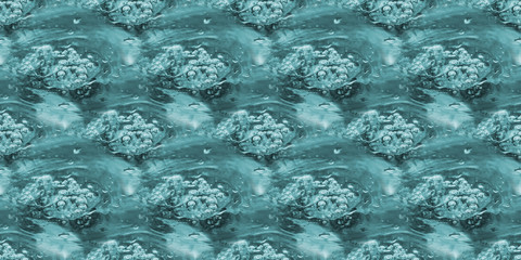 Blue boiling water with bubbles. Seamless horizontal background