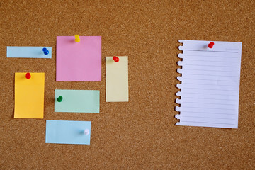 Piece paper of blank white note pad reminder and collection of colorful variety post. stick...