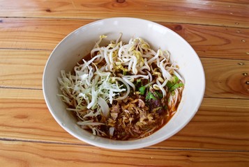 Rice noodle with spicy curry sauce, thai food called : khanom jeen nam ngeiw.