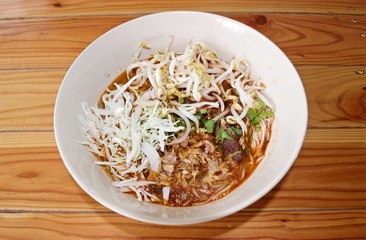 Rice noodle with spicy curry sauce, thai food called : khanom jeen nam ngeiw.