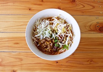 Rice noodle with spicy curry sauce, thai food called : khanom jeen nam ngeiw.