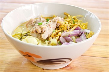 Curry Noodle Soup with Chicken (KhaoSoi Kai), Thai traditional northern style food.