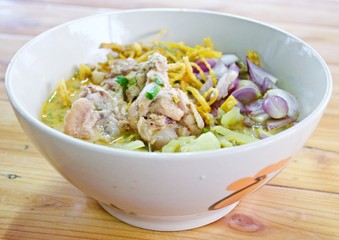 Curry Noodle Soup with Chicken (KhaoSoi Kai), Thai traditional northern style food.