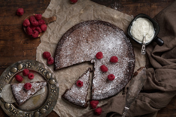 Chocolate mud cake kladdkaka or sticky chocolate cake with raspberries