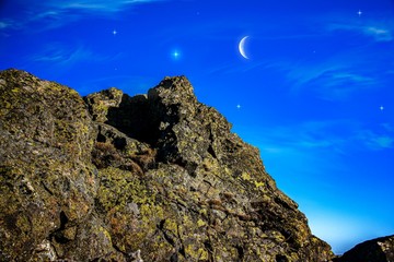 New moon . Religion background . The sky at night with stars. Ramadan background . Prayer time