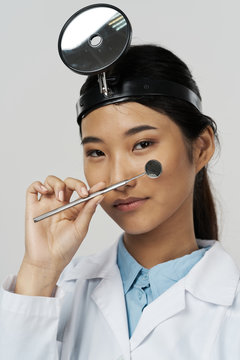 portrait of a young woman with makeup brush