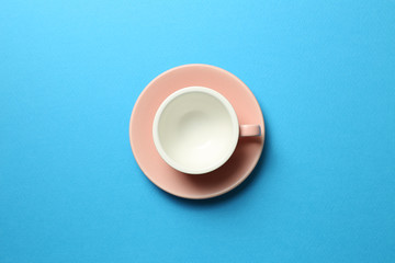 Pink coffee cup on blue background