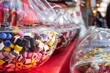 Candies in round boxes.