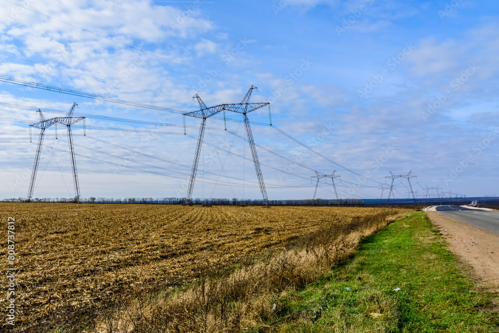 Wall mural high voltage power line in a field on autumn