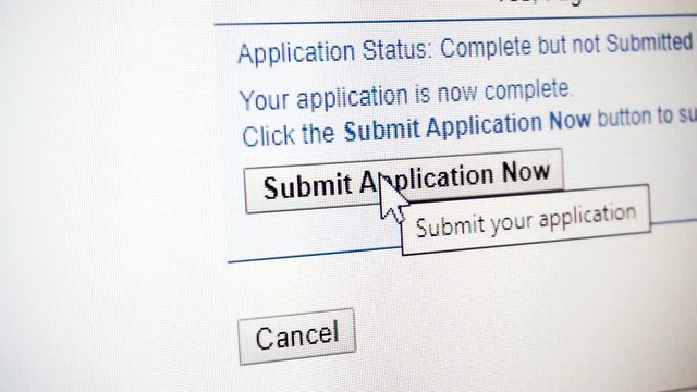Close up of mouse clicking 'Submit Application Now' button on computer monitor