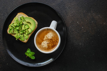 avocado sandwich, healthy food (bread, toasts, ration diet, fried eggs) menu concept. food background. top view. copy space