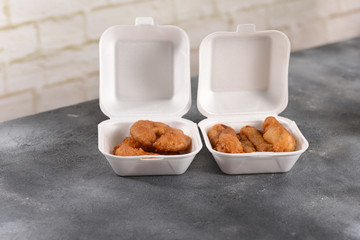 baked pineapple rings in a dough, delivered to a plastic can