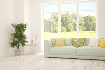 Stylish room in white color with sofa and summer landscape in window. Scandinavian interior design. 3D illustration